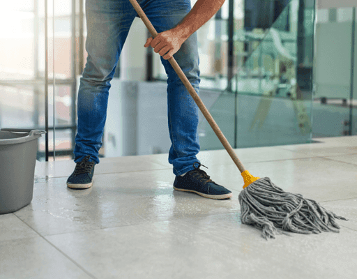 Mopping a tiled hallway floor